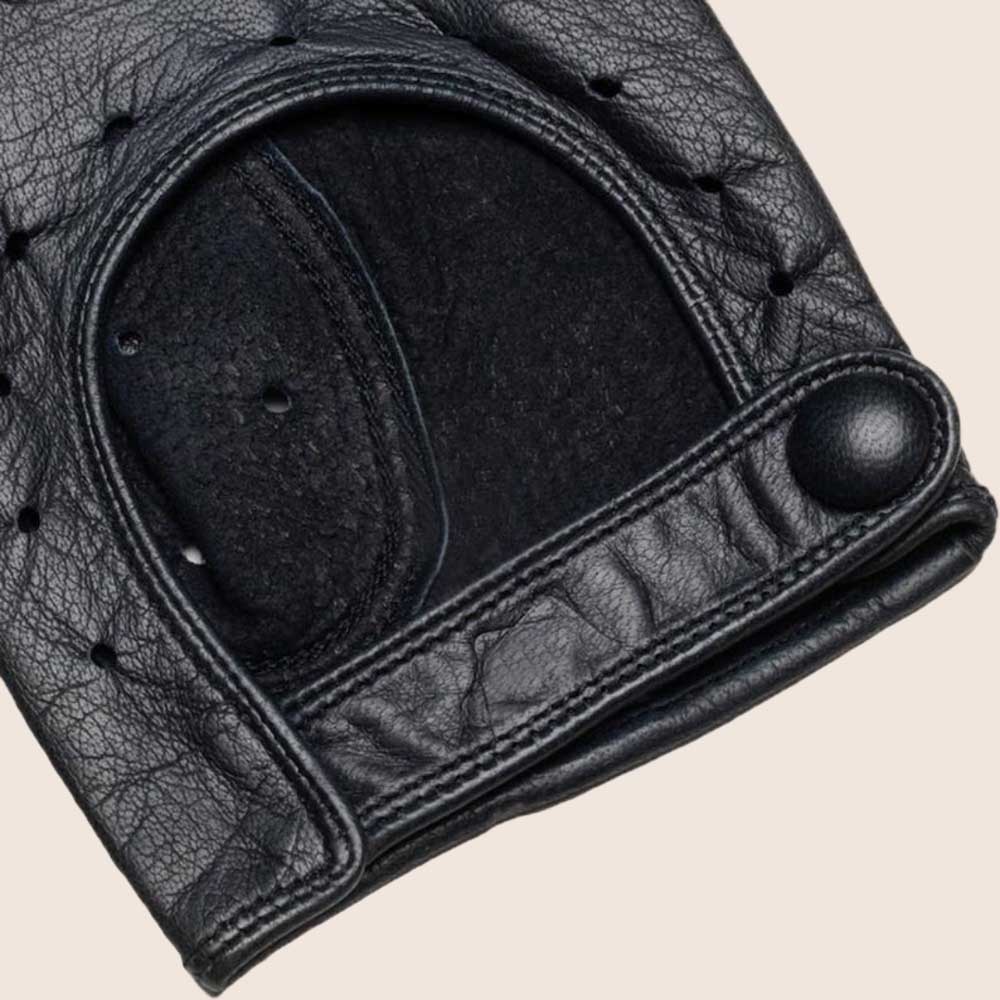 Close-up of a black leather glove with stitching details