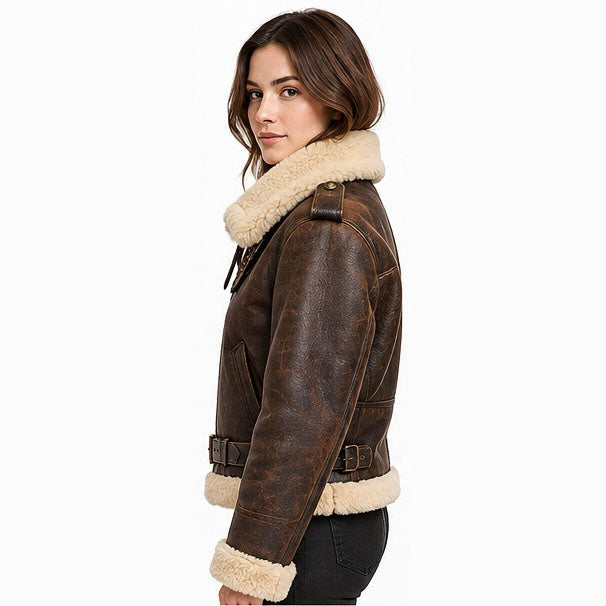 Women's custom B3 leather pilot jacket side view showing the tailored petite fit, shearling collar, leather shoulder strap, and adjustable waist belt.