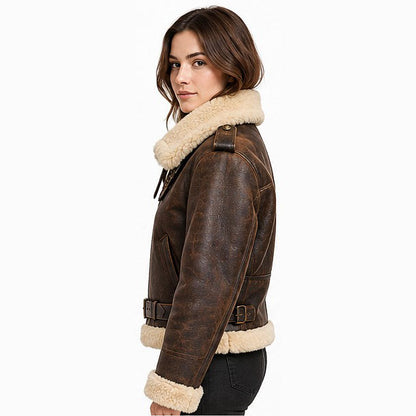 Women's custom B3 leather pilot jacket side view showing the tailored petite fit, shearling collar, leather shoulder strap, and adjustable waist belt.