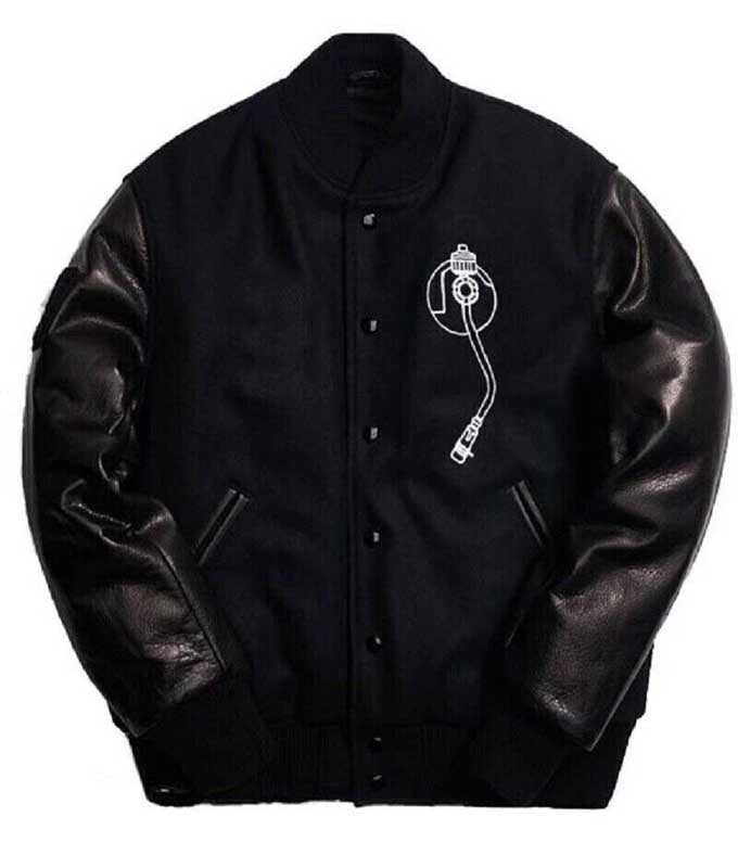 Front view of a black Def Jam varsity bomber jacket with embroidered patches and snap buttons.
