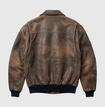 Brown A2-style leather bomber jacket with a pointed collar.