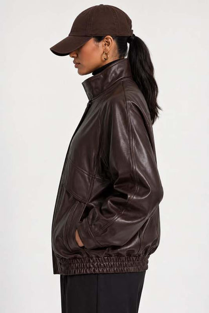 Women's oversized brown leather flight jacket with high-neck collar